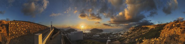 360° panoramic image of an enchanting sunset over the coastal landscape with the town of Arkasa, Arkasa, Karpathos, Greece, Europe