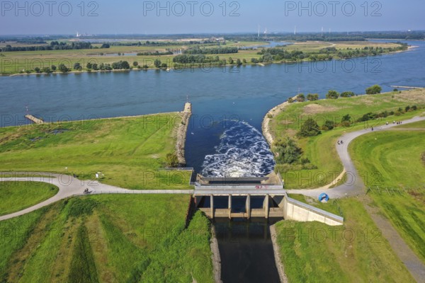 Dinslaken, North Rhine-Westphalia, Germany - Drop structure at the mouth of the Emscher into the Rhine. The mouth of the Emscher into the Rhine is being moved almost 500 metres north from Dinslaken to Voerde. Fish will then be able to swim barrier-free up the new Emscher from the Rhine through a newly created floodplain area. Following the construction of a parallel sewer, the Emscher has been completely free of sewage since January 2022. The river was previously an open, above-ground combined sewer with rainwater and wastewater