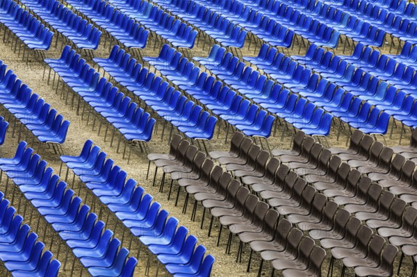Blue and black rows of chairs in the audience area of the summer festival in Lucca, Tuscany, Italy, Europe
