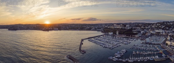 Sunset over Torquay Harbour and Marina, English Riviera from a drone, Devon, England, United Kingdom, Europe