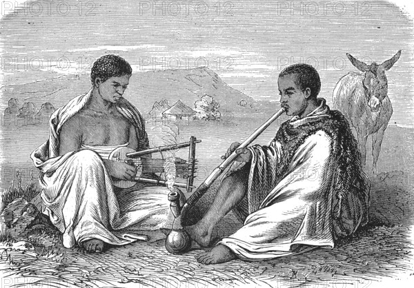 Abyssinia, Local peasants smoking a pipe and playing a musical instrument, 1869, Ethiopia, Historic, digitally restored reproduction of an original 19th century print, exact original date unknown, Africa
