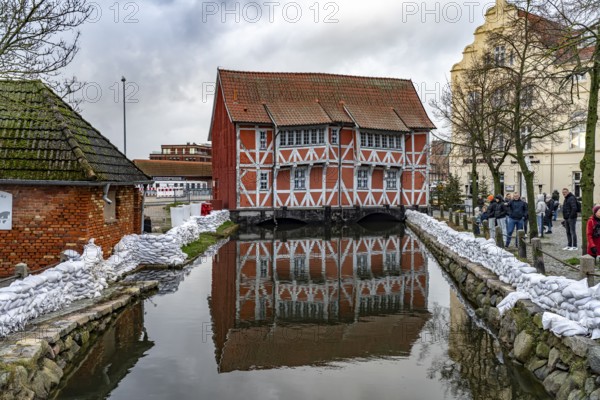 Half-timbered building vault over the round pit or mill stream in the historic old town, Hanseatic city of Wismar, Mecklenburg-Western Pomerania, Germany, Europe