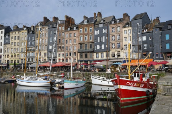 Honfleur, Normandy, France - Boats on the Quai Sainte-Catherine in the old harbour, Vieux Bassin, in the picturesque harbour town of Honfleur at the mouth of the Seine