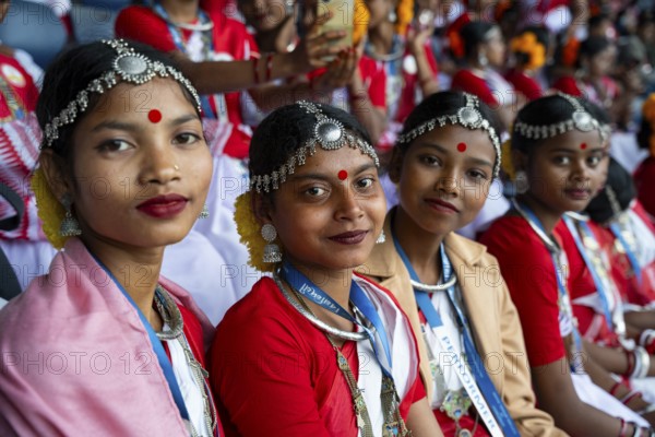 Girls from tea tribe community wearing traditional attire, wait to perform traditional Jhumur dance, on the eve of 'Jhumoir Binandini' event at the Sarusajai Stadium in Guwahati, India on February 23, 2025. Jhumur Dance is a traditional folk dance popular in Assam, West Bengal, Jharkhand, and Odisha, mainly performed by the Adivasi (Tea Tribe) community and other indigenous groups