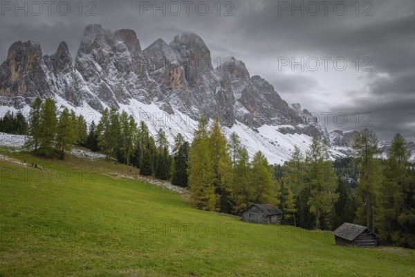 View of a part of the Geisler group in the foreground two mountain huts, Dolomites, snow, Puez-Geisler nature park Park, St. Magdalena, Villnöß, Funes, Villnößtal, South Tyrol, Italy, Europe