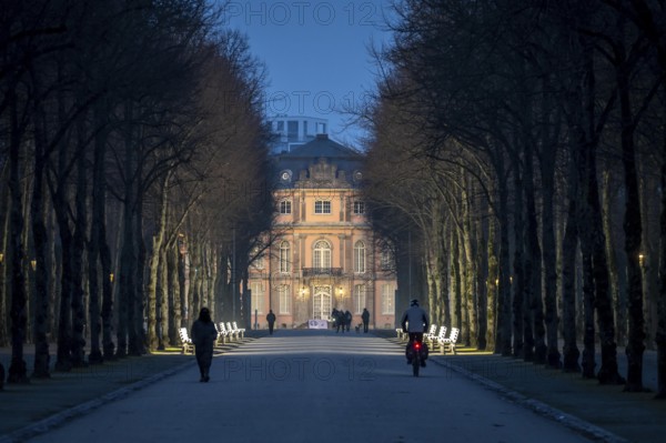 The light benches by artist Stefan Sous in the Hofgarten, entitled UV-A UV-B, 14 completely refurbished exhibits from the 2002 light-grey art exhibition, which now stand and light up as a permanent work of art on Jägerhofallee, LED technology, in the background Jägerhof Palace, home of the Goethe Museum, Düsseldorf, North Rhine-Westphalia, Germany, Europe