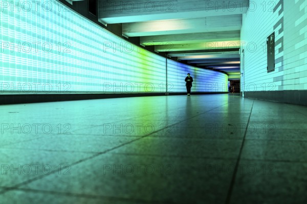 Passage under Essen's main railway station, connects entrances to the city and the main railway station, with the underground station, illuminated, LED wall, few people, Germany, Europe
