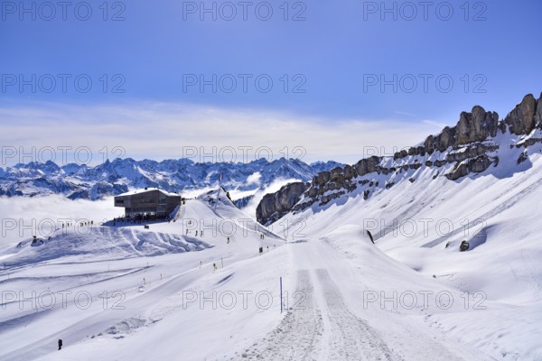 On the right the rock faces of the Hoher Ifen (2230 m) in Kleinwalsertal, on the left the mountain station of the Ifen mountain railway on the Gottesacker plateau, Allgäu, Vorarlberg, Austria, Europe