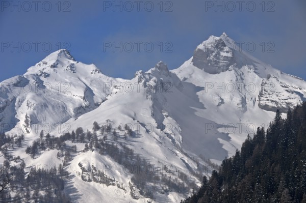 Snow-covered peaks of the Bernese Alps rise out of the fog, Bernese Alps, near Ovronnaz, Switzerland, Europe