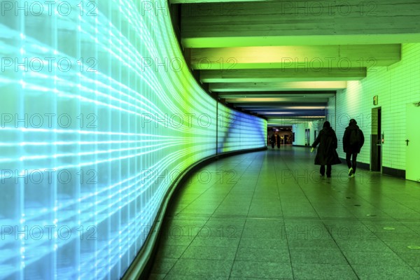 Passage under Essen's main railway station, connects entrances to the city and the main railway station, with the underground station, illuminated, LED wall, few people, Germany, Europe