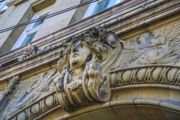 Decoration, portal at the entrance, female head made of stone, Königin-Katharina-Stift, grammar school, Katharinenstift, Katzenstift, Baden-Württemberg, Germany, Europe