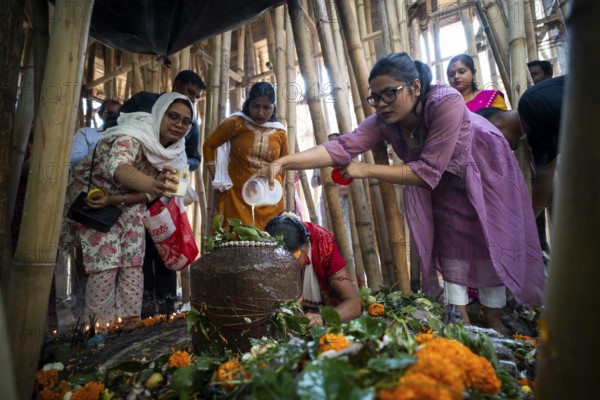 Devotees offer prayers to a Shiva linga on the occasion of Maha Shivaratri, on February 26, 2025 in Guwahati, India, Asia