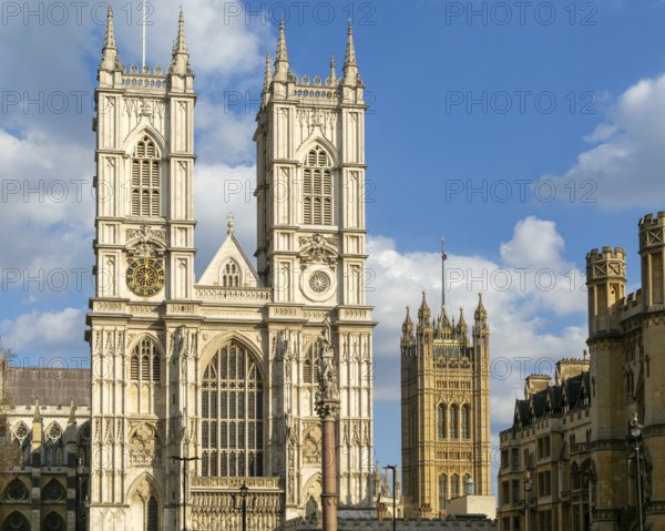 Towers and frontage of Westminster abbey church with Victoria Tower in background, Westminster, London, England, UK