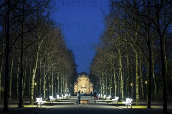 The light benches by artist Stefan Sous in the Hofgarten, entitled UV-A UV-B, 14 completely refurbished exhibits from the 2002 light-grey art exhibition, which now stand and light up as a permanent work of art on Jägerhofallee, LED technology, in the background Jägerhof Palace, home of the Goethe Museum, Düsseldorf, North Rhine-Westphalia, Germany, Europe