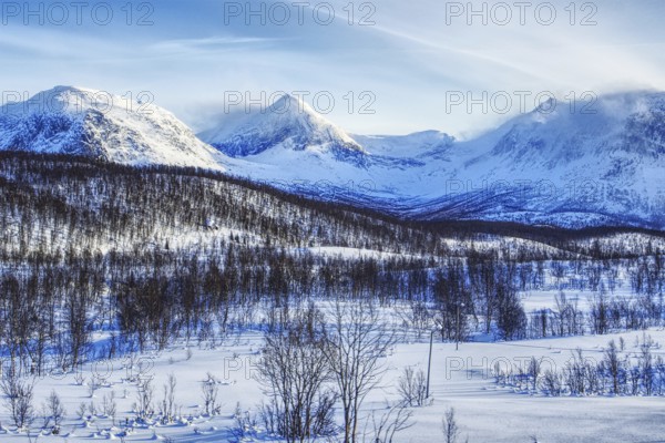 Impressive snow-covered mountain landscape under a blue sky, Norway, Europe