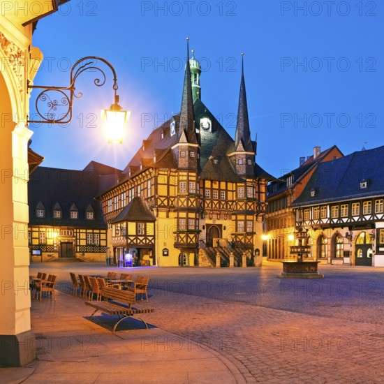 Market square with atmospherically illuminated town hall in the evening, Wernigerode, Harz, Saxony-Anhalt, Germany, Europe