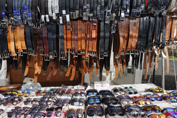 Sunday market, sunglasses and leather belts, souvenirs at a market stall in the old town, Teguise, Lanzarote, Spain, Europe