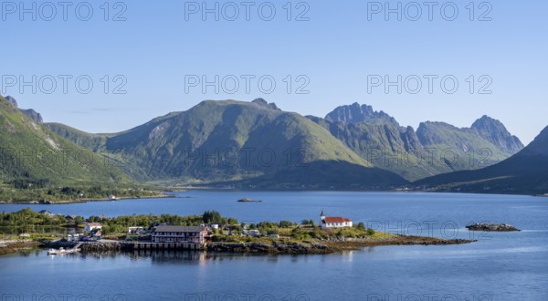 Place and small church Sildpollnes Kirke at the fjord Austnesfjorden, idyllic Norwegian fjord landscape, Sildpollen, Nordland, Norway, Europe