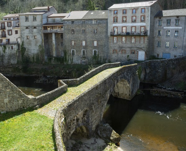 Olliergues village. Old bridge on river Dore. Natural regional park of Livradois Forez. Puy de Dome. Auvergne Rhone Alpes. France