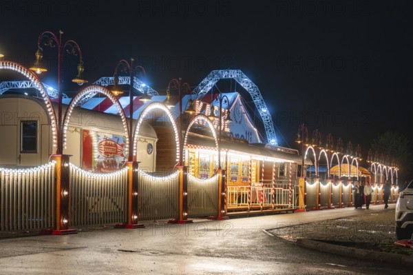 Festively illuminated circus with blue arches and lights that radiate a festive atmosphere, Böblingen, Germany, Europe