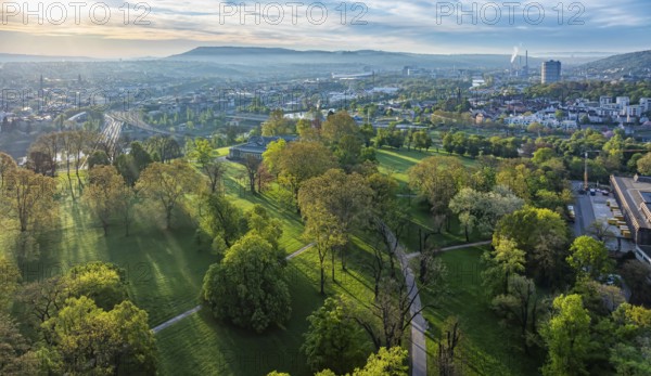 Rosensteinpark in the early morning, view of the cityscape of Bad Cannstatt. Aerial view. Stuttgart, Baden-Württemberg, Germany, Europe