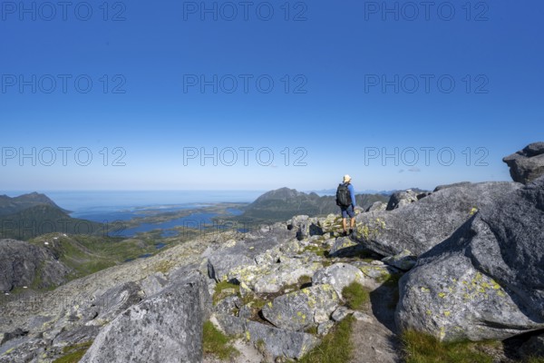 View of mountains and fjord landscape, mountain panorama, mountaineer at the summit of Rundfjellet, Svolvaer, Nordland, Norway, Europe
