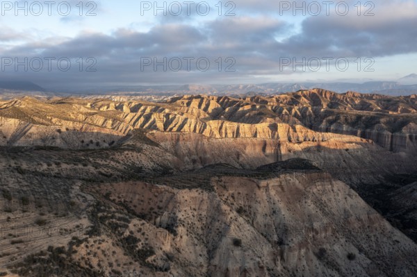 Sunrise, wide hilly desert landscape with dry vegetation, Gorafe desert, semi-desert, Granada, Andalusia, Spain, Europe