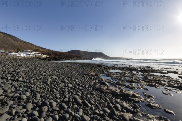 Rocky west coast, black lava coast, coastline, sunbeams, El Golfo, Yaiza, Lanzarote, Spain, Europe