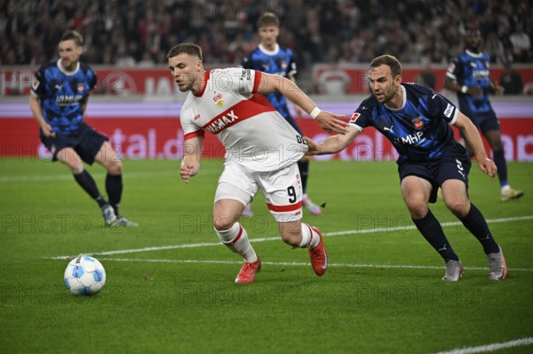 Duel, action Ermedin Demirovic VfB Stuttgart (09) against Benedikt Gimber 1. FC Heidenheim 1846 FCH (05) Shirt pull MHPArena, MHP Arena Stuttgart, Baden-Württemberg, Germany, Europe
