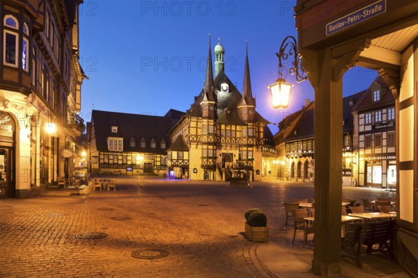 Market square with atmospherically illuminated town hall in the evening, Wernigerode, Harz, Saxony-Anhalt, Germany, Europe