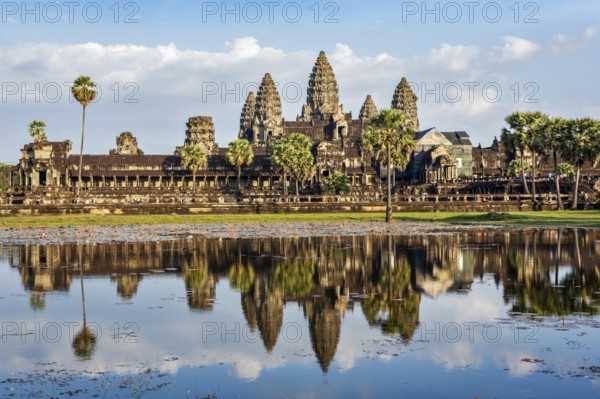Famous Cambodian landmark and tourist attraction Angkor Wat with reflection in water. Cambodia, Siem Reap