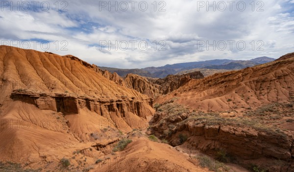 Eroded mountain landscape with sandstone cliffs, canyon with red and orange rock formations, Konorchek Canyon, Chuy, Kyrgyzstan, Asia