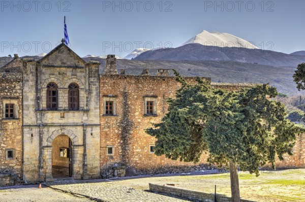HDR, main entrance, national flag, forecourt, tree, Ida massif, Psiloritis, snow-capped mountain, Arkadi, Orthodox Monastery, national monument, Rethimnon province, Crete, Greece, Europe