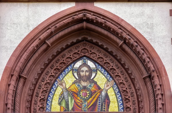 Musical depiction of Jesus Christ in the pointed arch of the main portal of the Church of the Sacred Heart in Freiburg im Breisgau, Baden-Württemberg, Germany, Europe