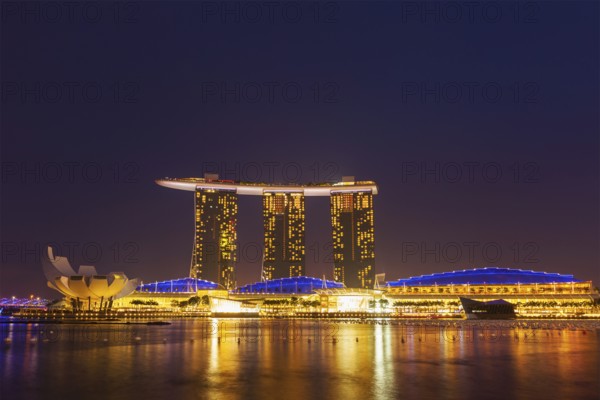 SINGAPORE, JANUARY 1, 2014, : The Marina Bay Sands complex in the night, Marina Bay Sands is an integrated resort and billed as the world's most expensive standalone casino property