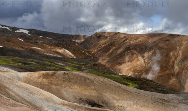Steaming hot springs and colourful rhyolite mountains, Hveradalir geothermal area, Kerlingarfjöll, Icelandic highlands, Iceland, Europe