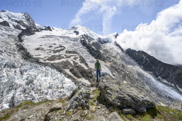 Mountaineers on the glacier, High alpine glaciated mountain landscape, La Jonction, Glacier des Bossons meets Glacier de Taconnaz, Summit of Mont Maudit and Mont Blanc, Chamonix, Haute-Savoie, France, Europe