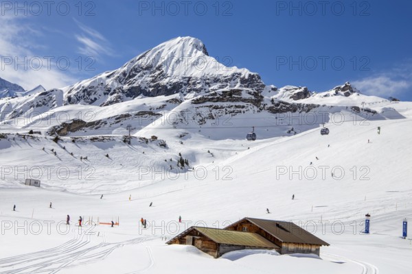 26 March 2024: Skiing against the backdrop of the Bernese Alps in Grindelwald, Switzerland. The mountain in the picture is the Tschuggen