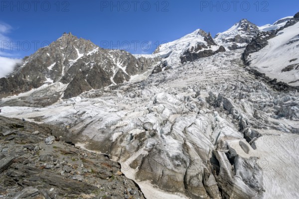 High alpine glaciated mountain landscape, La Jonction, Glacier des Bossons meets Glacier de Taconnaz, summit of Aiguille du Midi, Mont Maudit and Mont Blanc, Chamonix, Haute-Savoie, France, Europe