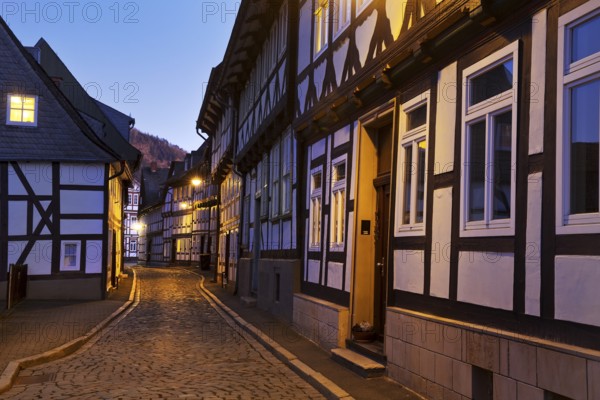 Narrow alley with half-timbered houses and cobblestones in the old town centre in the evening, UNESCO World Heritage Site, Goslar, Lower Saxony, Germany, Europe