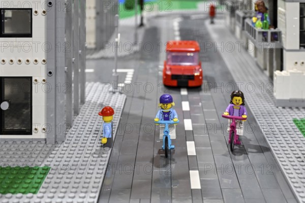 Lego figure with bicycle