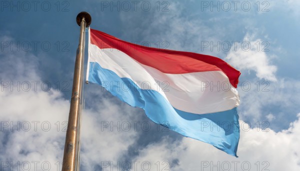 Flags, the national flag of Luxembourg flutters in the wind