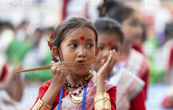 A girl plays Gagana (musical instrument) as she participate in a Bihu dance workshop, ahead of Rongali Bihu festival, in Guwahati, Assam, India on 6 April 2024. Bihu dance is a traditional dance form from the state of Assam, associated with the Bihu festival, which marks the beginning of the Assamese New Year