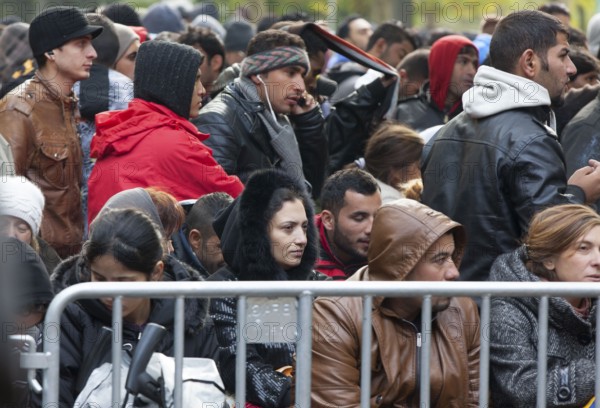 Refugees from Syria waiting to be registered at the Central Reception Centre for Asylum Seekers at the Berlin State Office for Health and Social Affairs, 09.10.2015