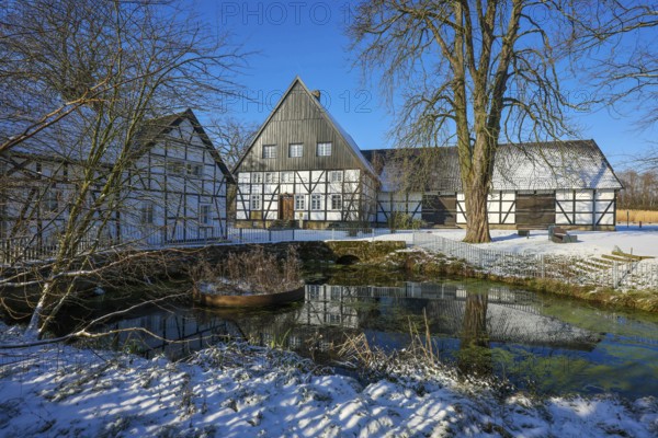 Holzwickede, Ruhr area, North Rhine-Westphalia, Germany, Winter with snow in the Ruhr area, Emscher spring, the river Emscher rises at the Emscherquellhof in Holzwickede near Dortmund, Europe
