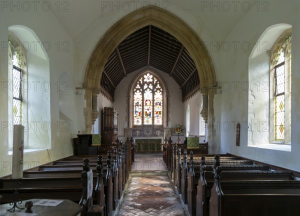 Interior view to altar and east window church of All Saints, Rede, Suffolk, England, UK