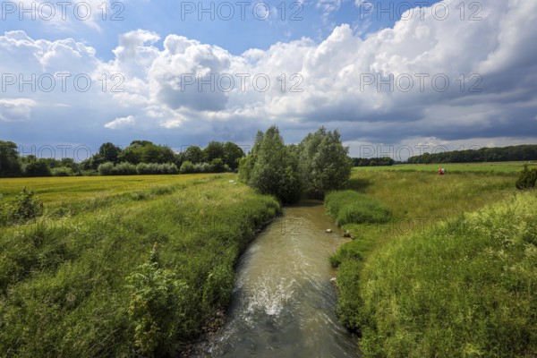 Kamen, Ruhr area, North Rhine-Westphalia, Germany, Spring landscape on the Seseke. The renaturalised Seseke, a tributary of the Lippe, has been transformed into a near-natural watercourse, flood protection and biodiversity through newly designed floodplains. Following the construction of a parallel sewer, the Seseke is now free of wastewater, having previously been an open, above-ground wastewater sewer, combined sewer with surface water and wastewater, Europe