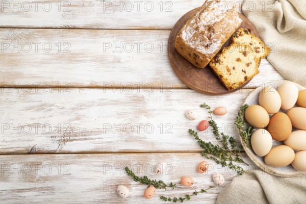 Homemade easter pie with raisins and eggs on plate on a gray concrete background and linen textile. top view, flat lay, copy space