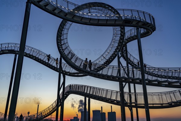 Landmark Angerpark Tiger & Turtle, Magic Mountain, walk-in sculpture in the form of a rollercoaster on the Heinrich-Hildebrand-Höhe spoil tip, HKM steelworks, sunset, Duisburg, North Rhine-Westphalia, Germany, Europe