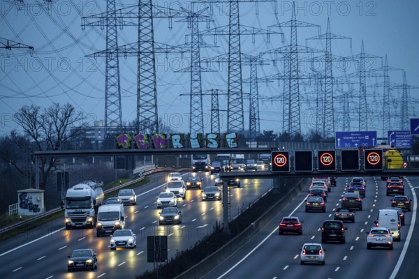 A57 motorway near Kaarst in the Rhine district of Neuss, view in the direction of the Kaarst motorway junction, heavy evening traffic, overhead power lines, along the motorway, North Rhine-Westphalia, Germany, Europe